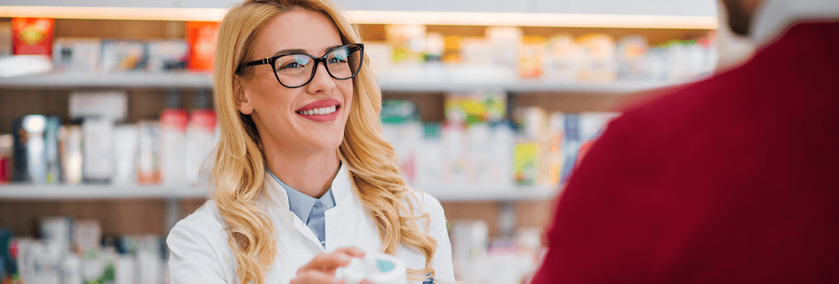 female pharmacist helping customer