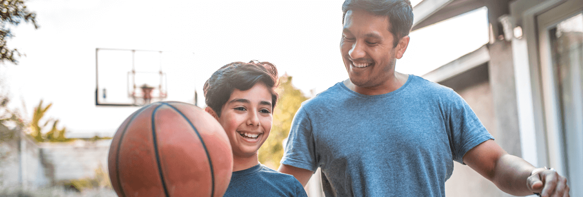 father and son with basketball