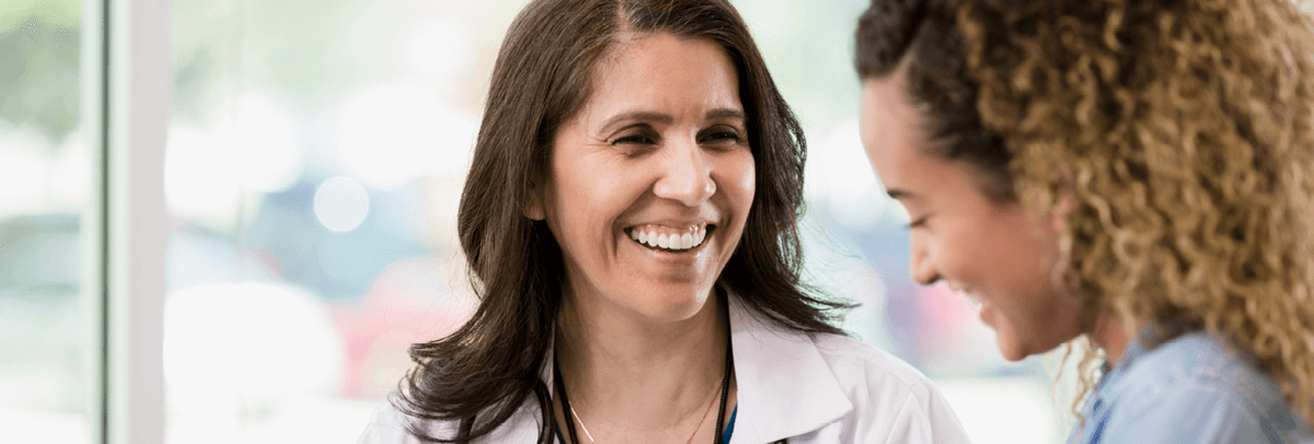 female doctor with young female patient