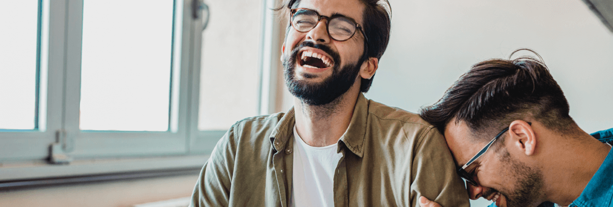 male couple laughing