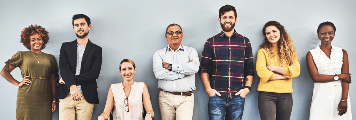 office colleagues standing against wall