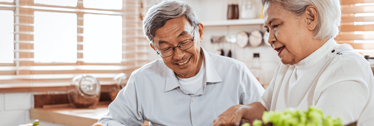older couple preparing a meal at home