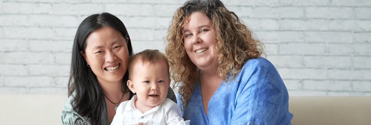two moms and baby
